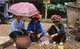 Vietnam: Tai women selling bunches of longan fruit in the market at Thuan Chau (Thuận Châu), Son La (Sơn La) Province, Northwest Vietnam